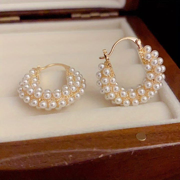 Boucles d'oreilles créoles avec perles superposées