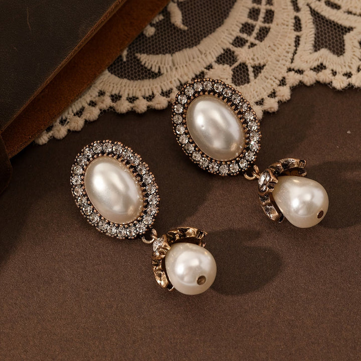 Boucles d'Oreilles Pendantes avec Cadre Vintage en Perles