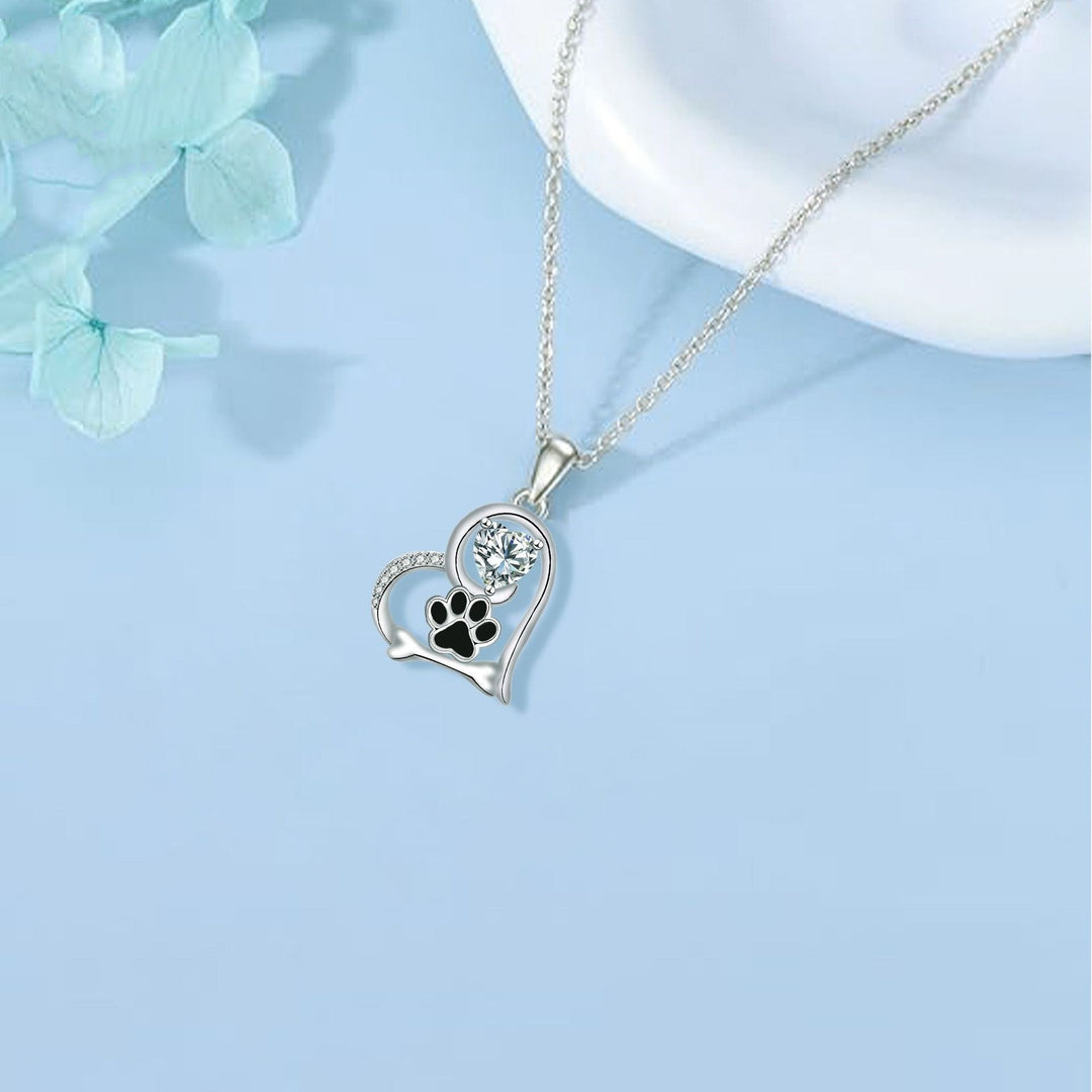 Collier en Argent Fait Main avec Empreinte de Patte de Chien et Détail en Os avec Zirconia