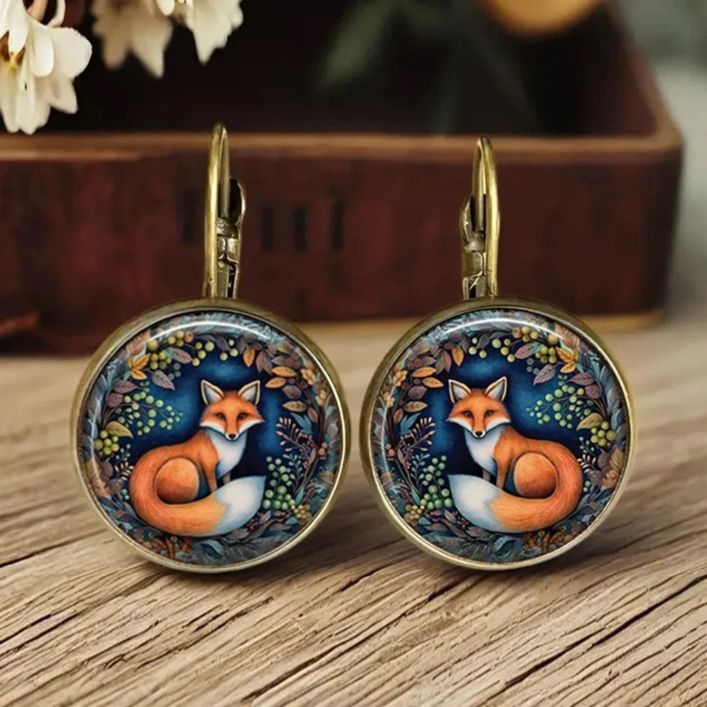 Boucles d'oreilles en verre sous dôme avec animaux fantaisistes