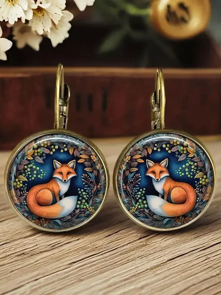 Boucles d'oreilles en verre sous dôme avec animaux fantaisistes