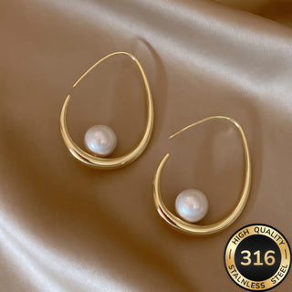 Boucles d'oreilles créoles avec perles croissantes